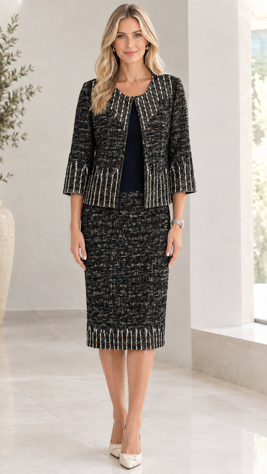 Front view of women wearing black tweed two-piece skirt suit set