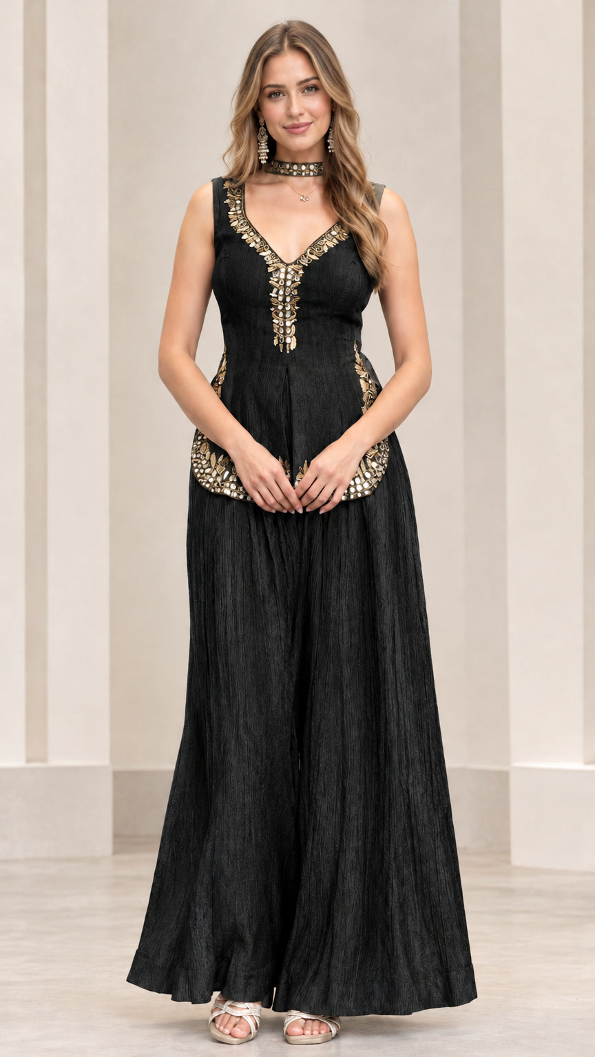 Front view of black embroidered sleeveless peplum top and wide palazzo pants set