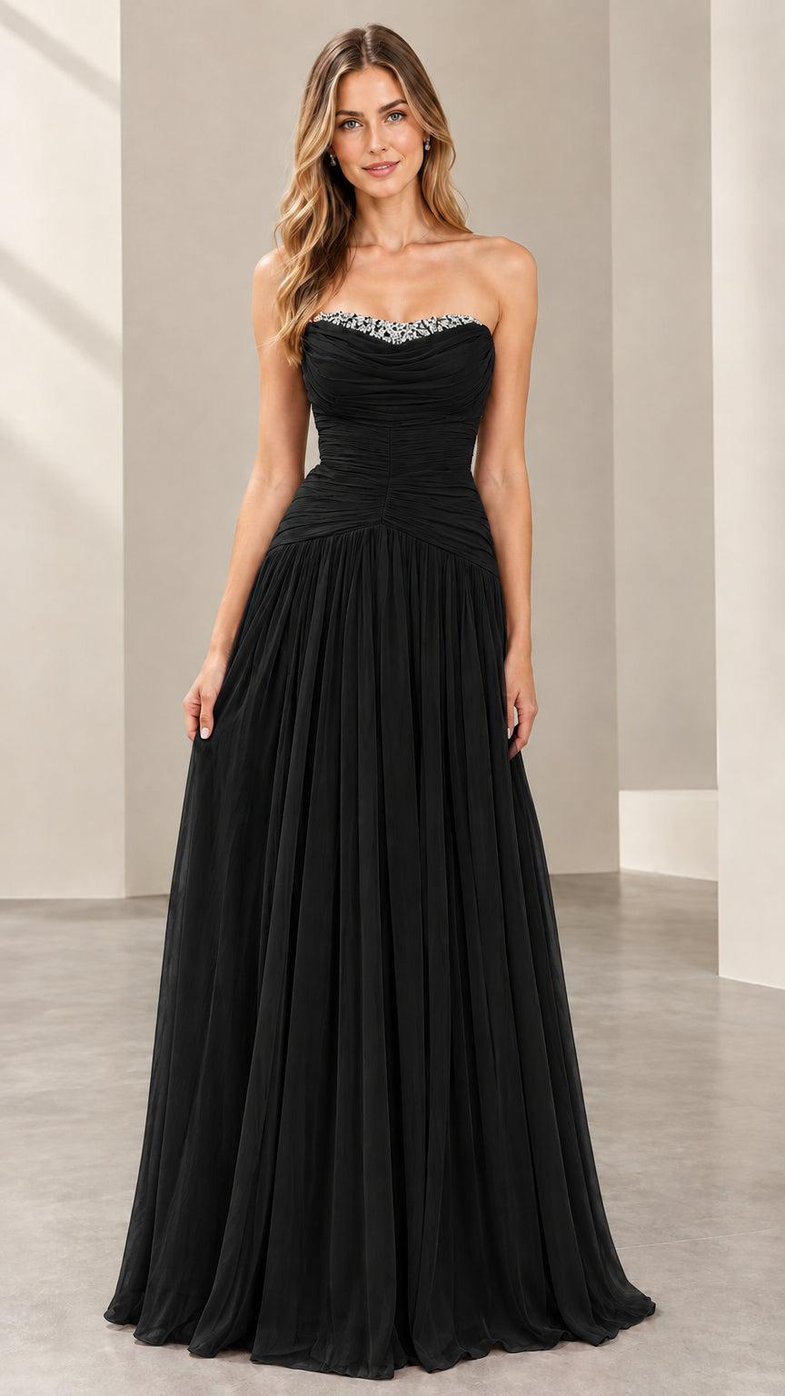 Front view of woman wearing the strapless ruched evening gown in black