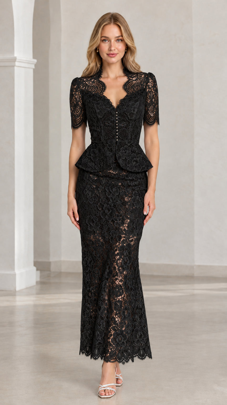 Front view of woman wearing black floral lace peplum maxi two-piece set