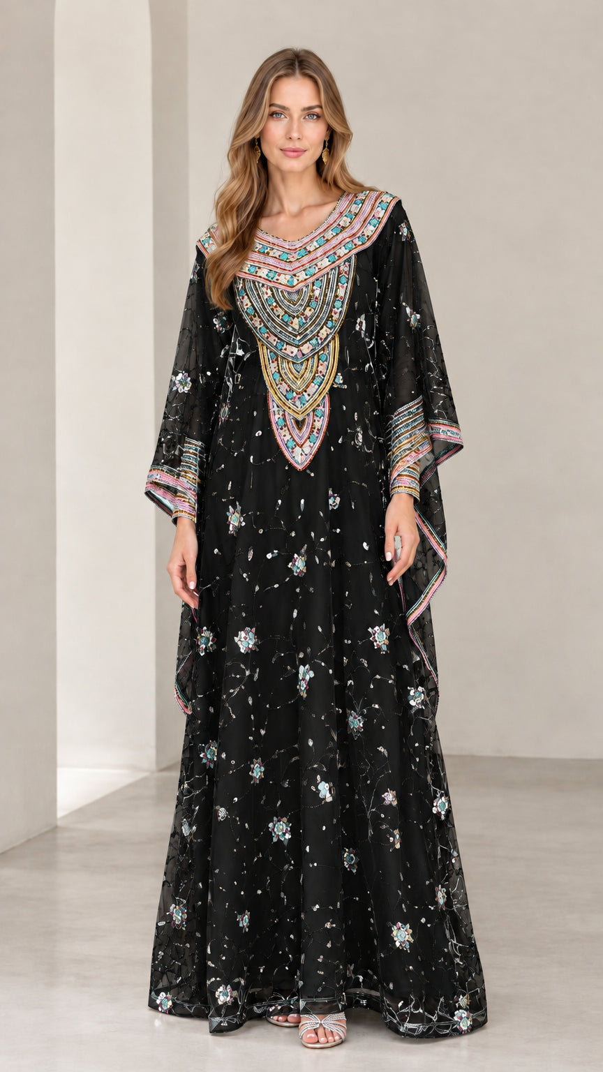 Full-length view of woman wearing Black embroidered kaftan maxi dress