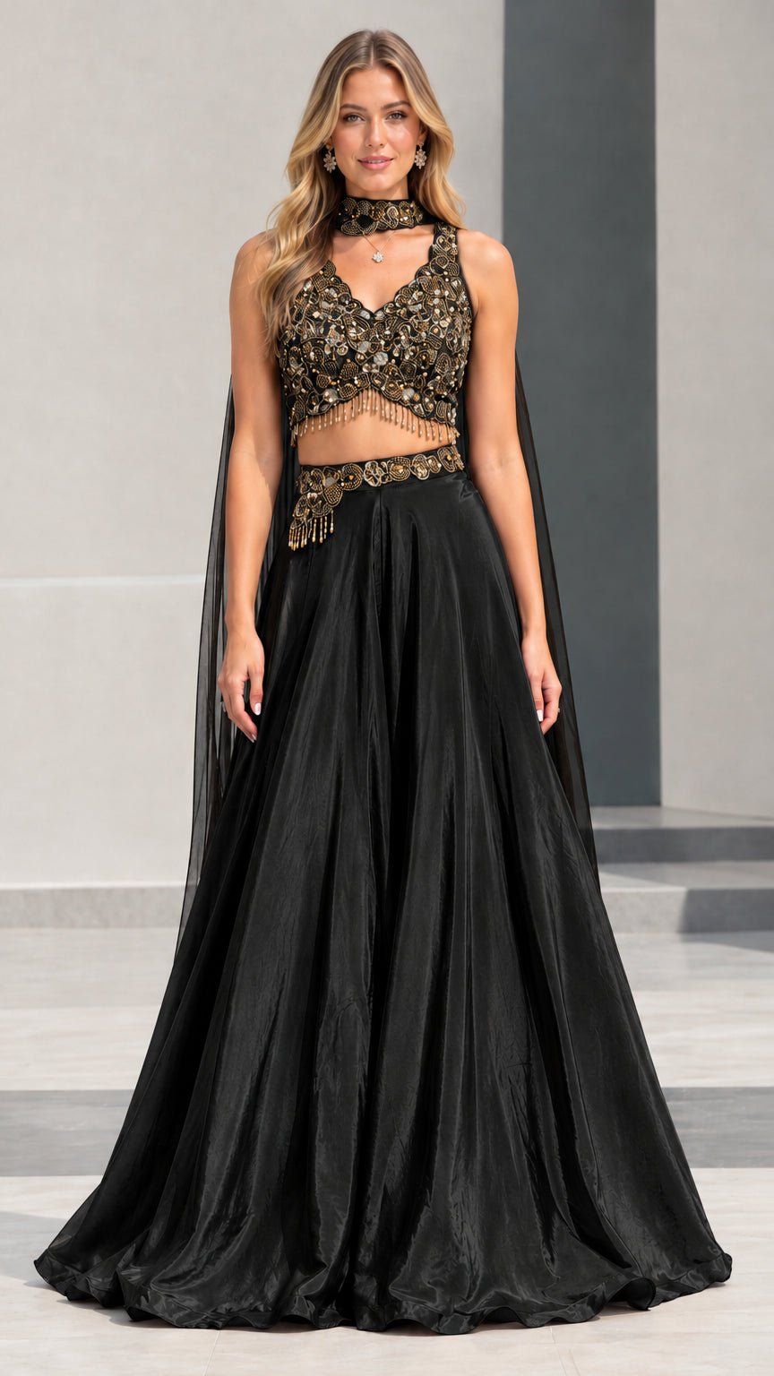 Black and gold embroidered crop top with cape and matching black maxi skirt