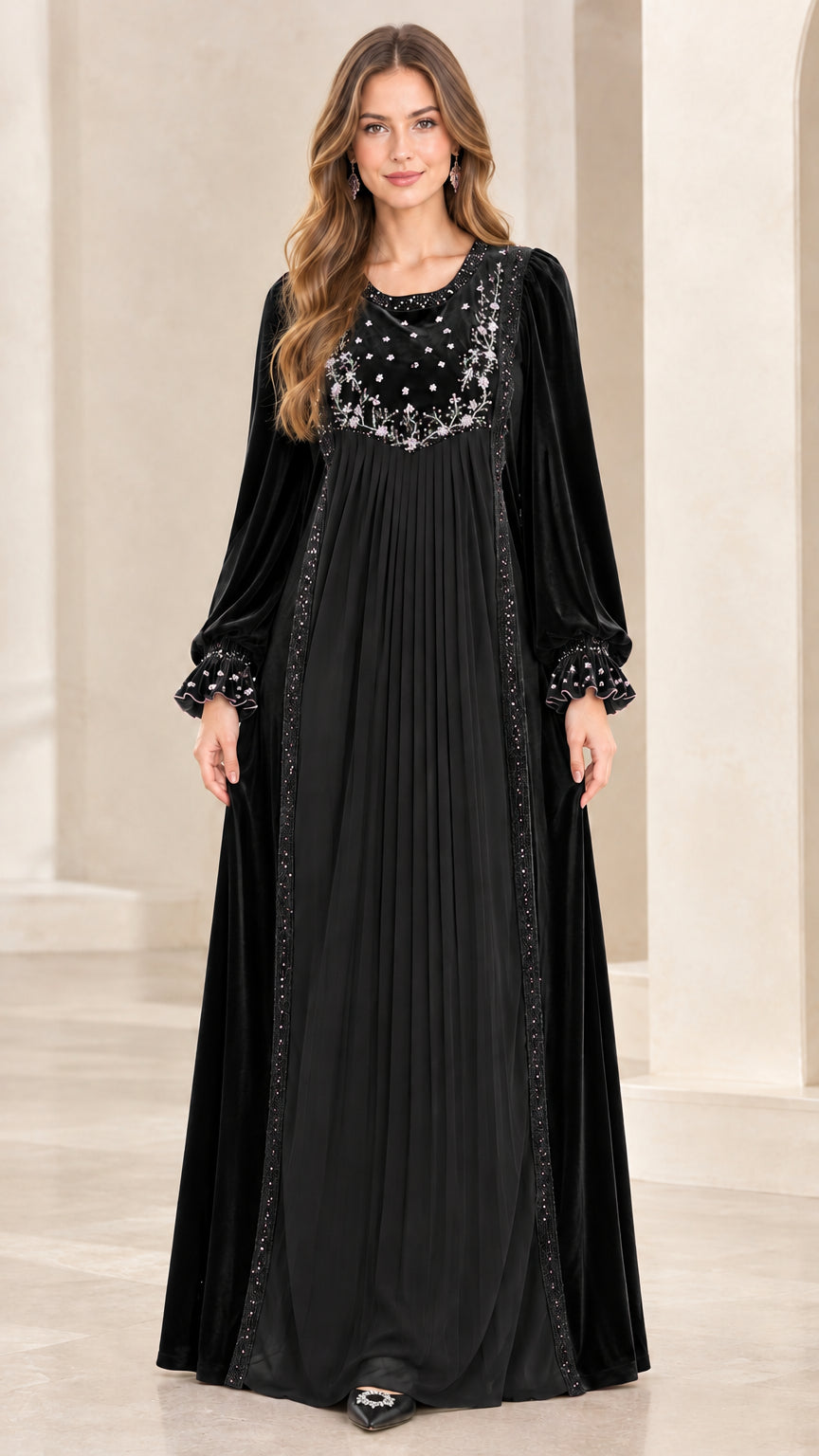 Full-length front view of woman wearing Black embroidered velvet pleated maxi dress