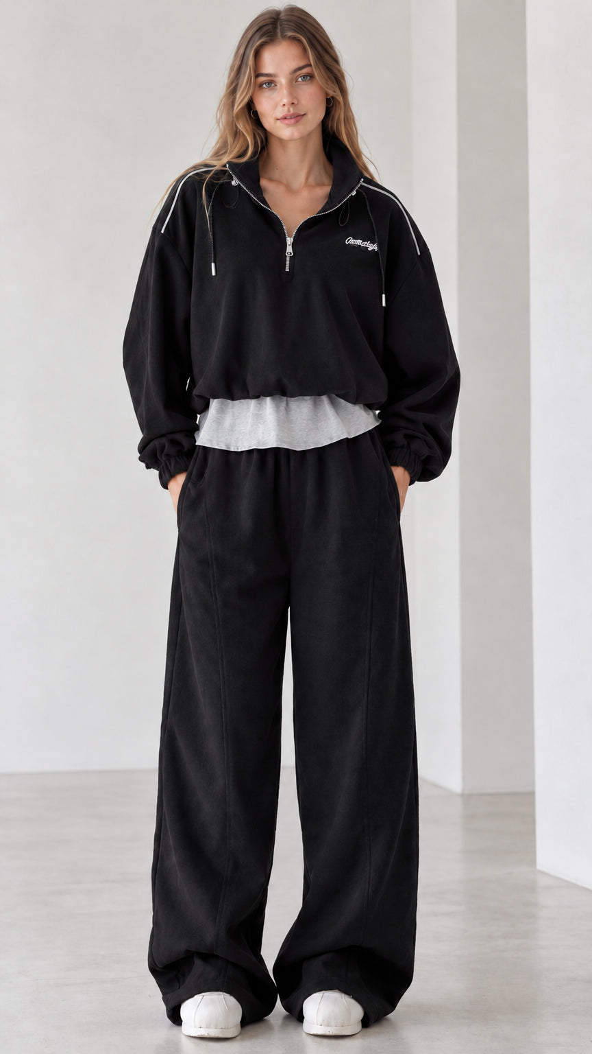 Women's black two-piece half-zip sweatshirt and wide-leg sweatpants set