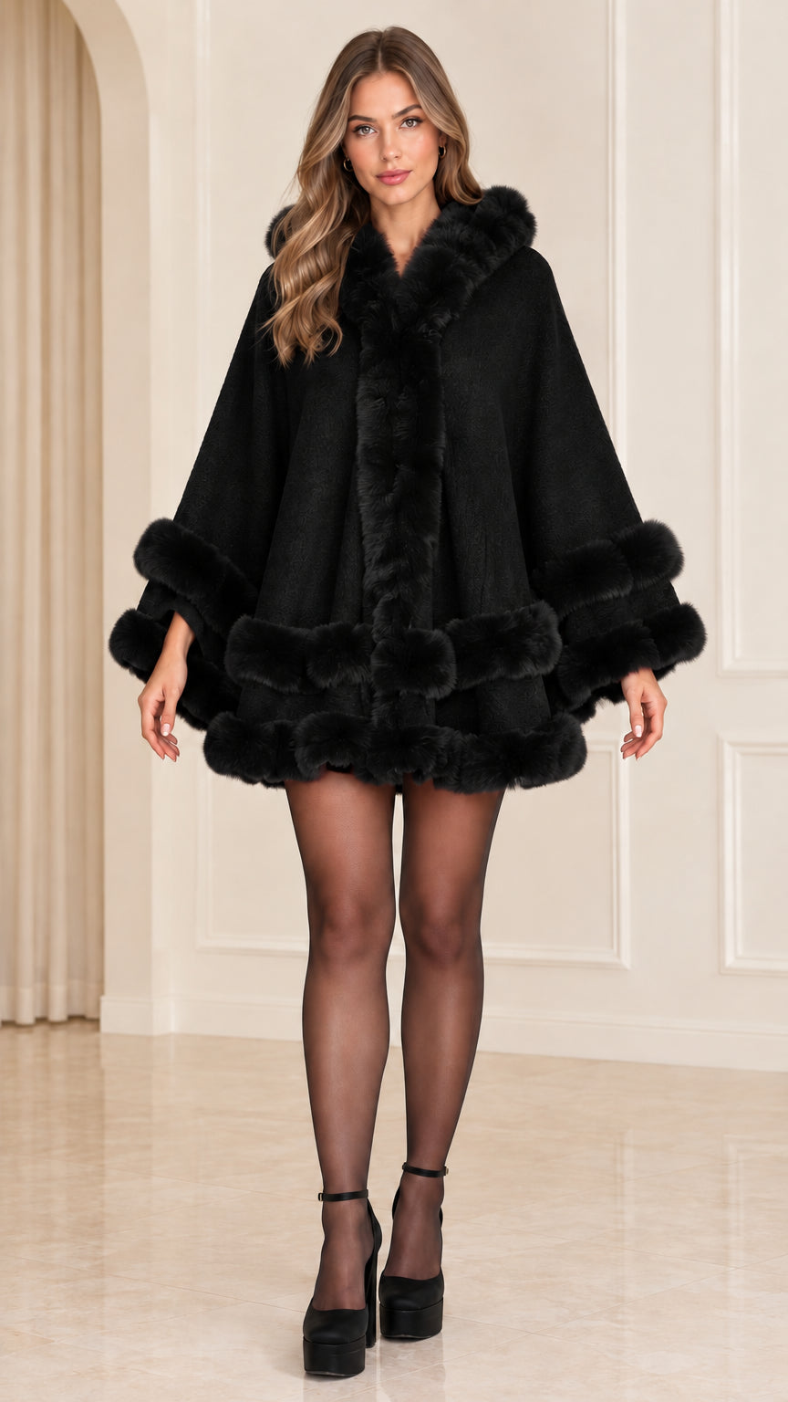 Front view of black faux fur trimmed hooded cape coat