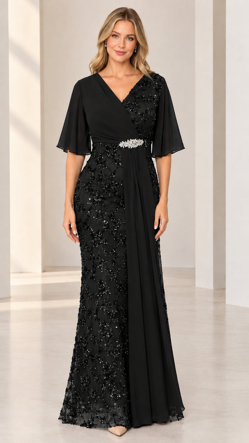 Front full-length view of black sequin embroidered evening gown with flutter sleeves