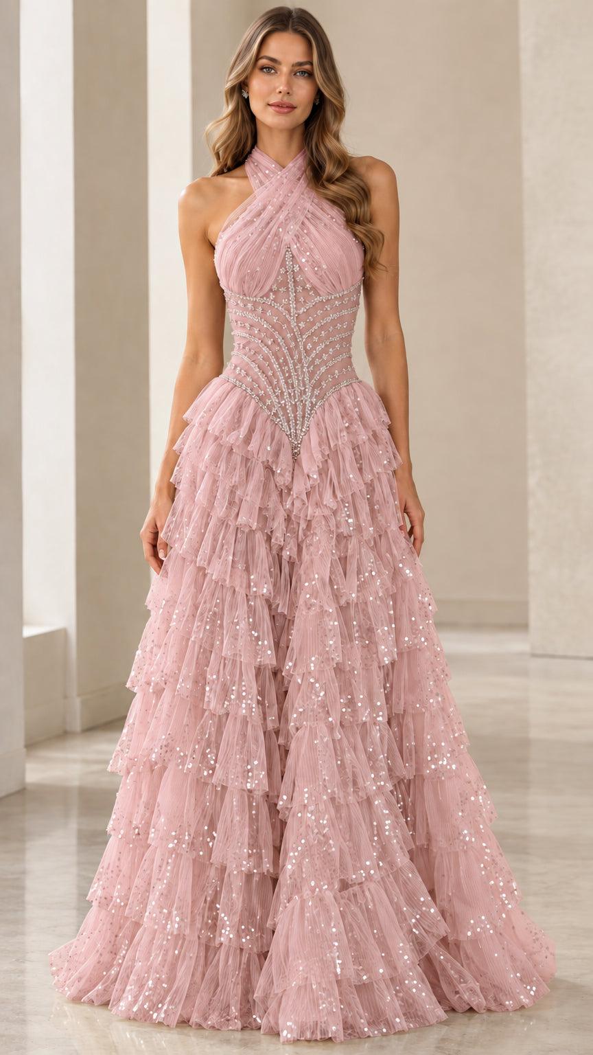 Model wearing a Blush Pink halter neck beaded tiered tulle formal gown