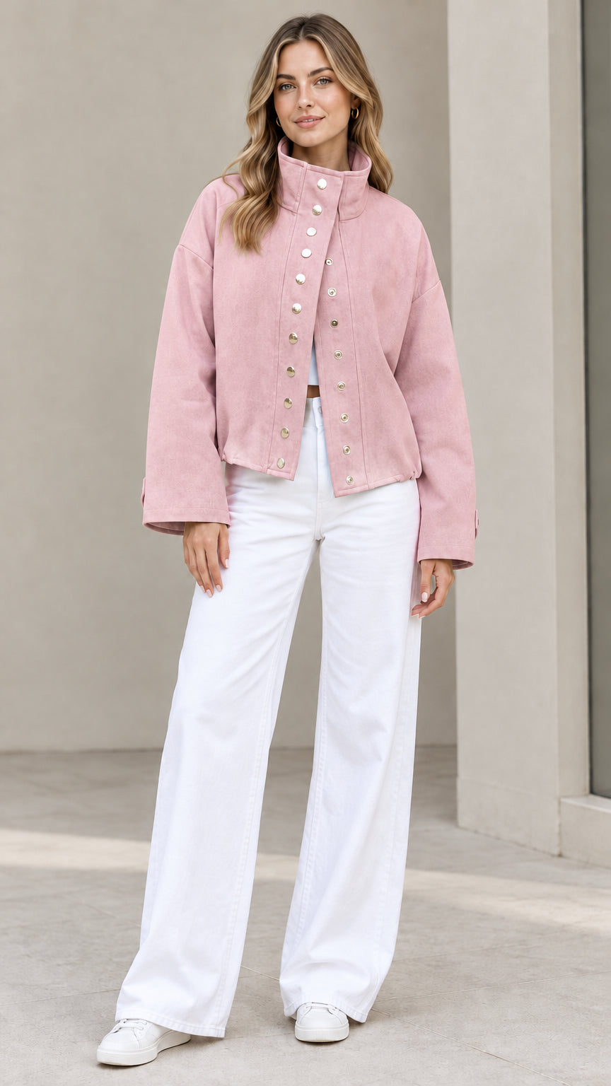 Full-length view of woman wearing Dusty Pink stand collar snap jacket with white pants