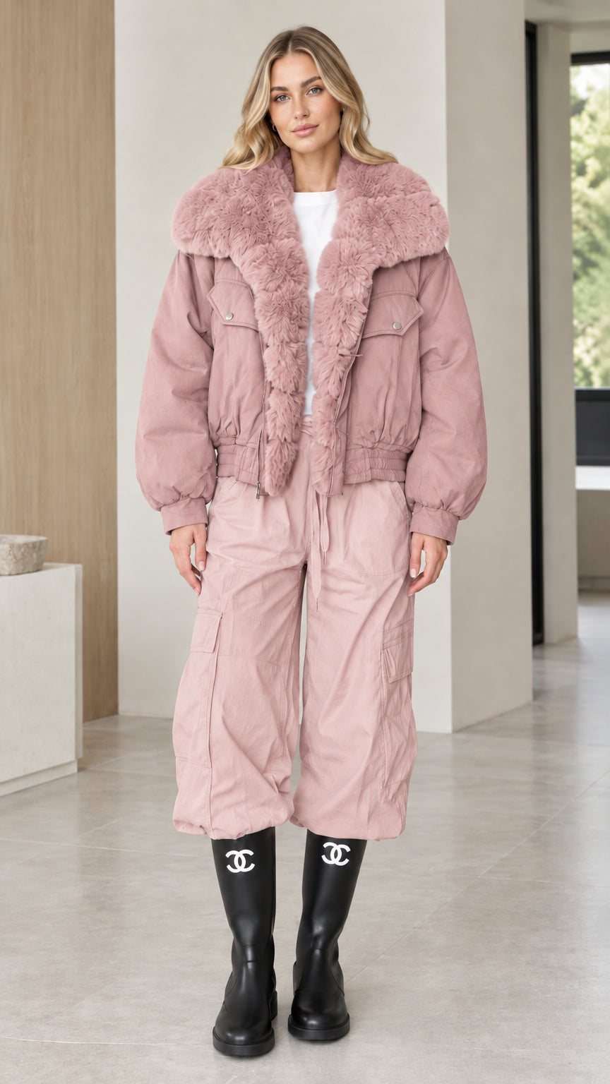 Model wearing dusty pink faux fur trim bomber jacket with matching pants