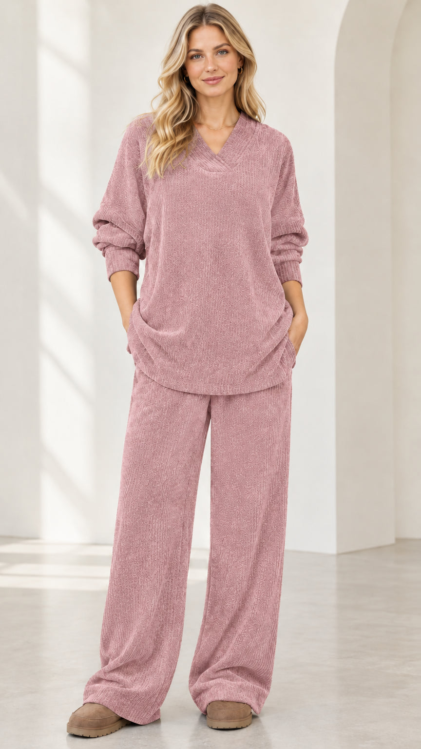 Front view of woman wearing dusty pink ribbed knit V-neck top and wide leg pants lounge set