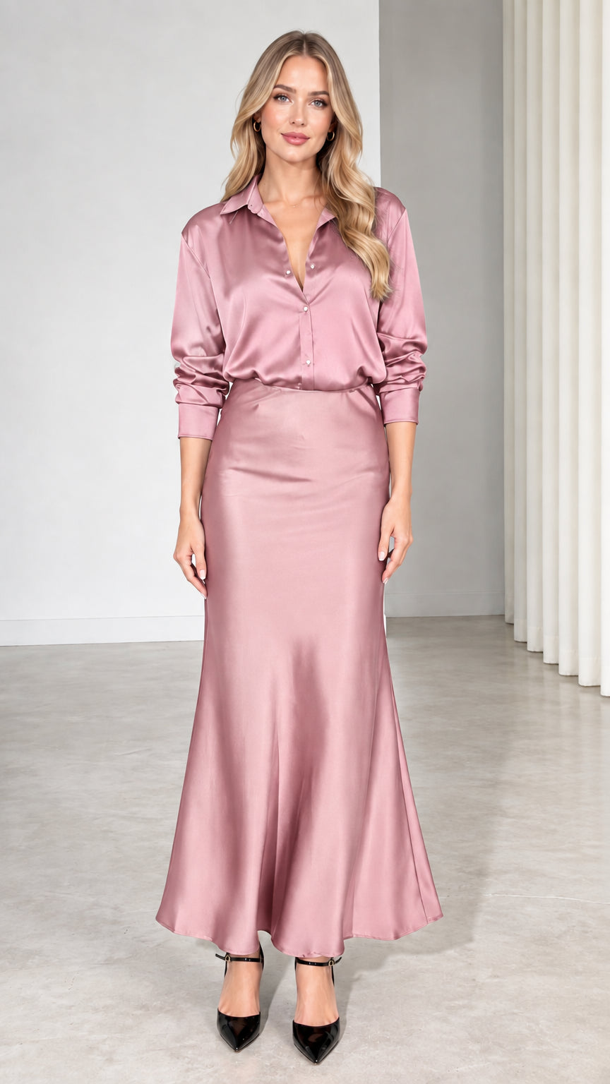 Model wearing dusty rose satin long sleeve shirt and matching maxi skirt set
