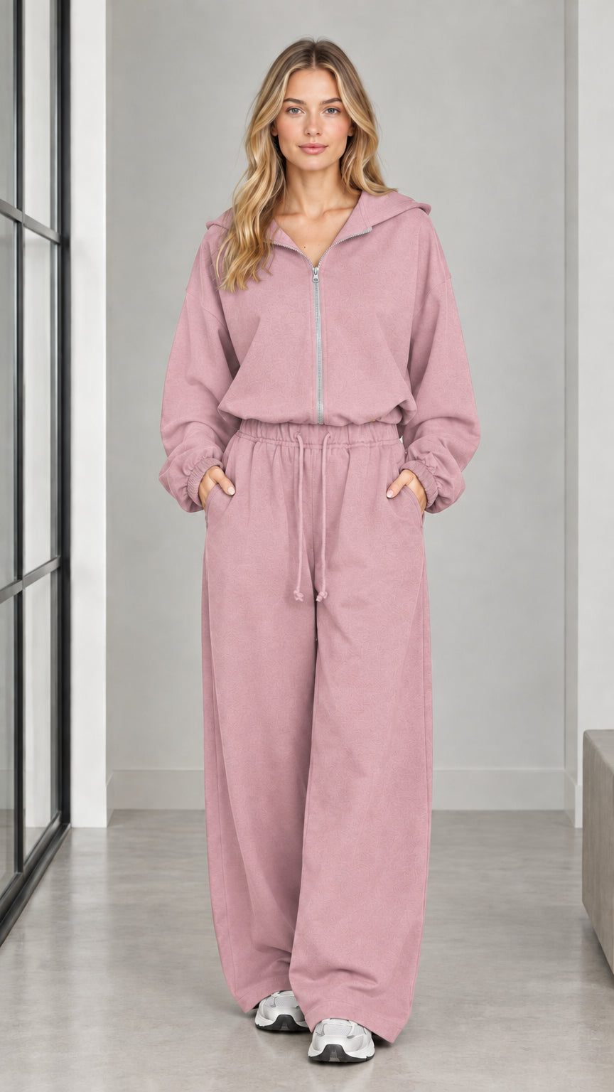 Front full-length view of woman wearing the dusty pink hooded wide-leg jumpsuit