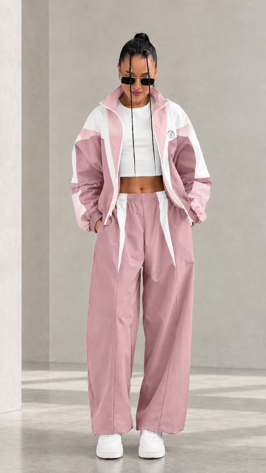 Model wearing Dusty Pink colorblock tracksuit set with white accents