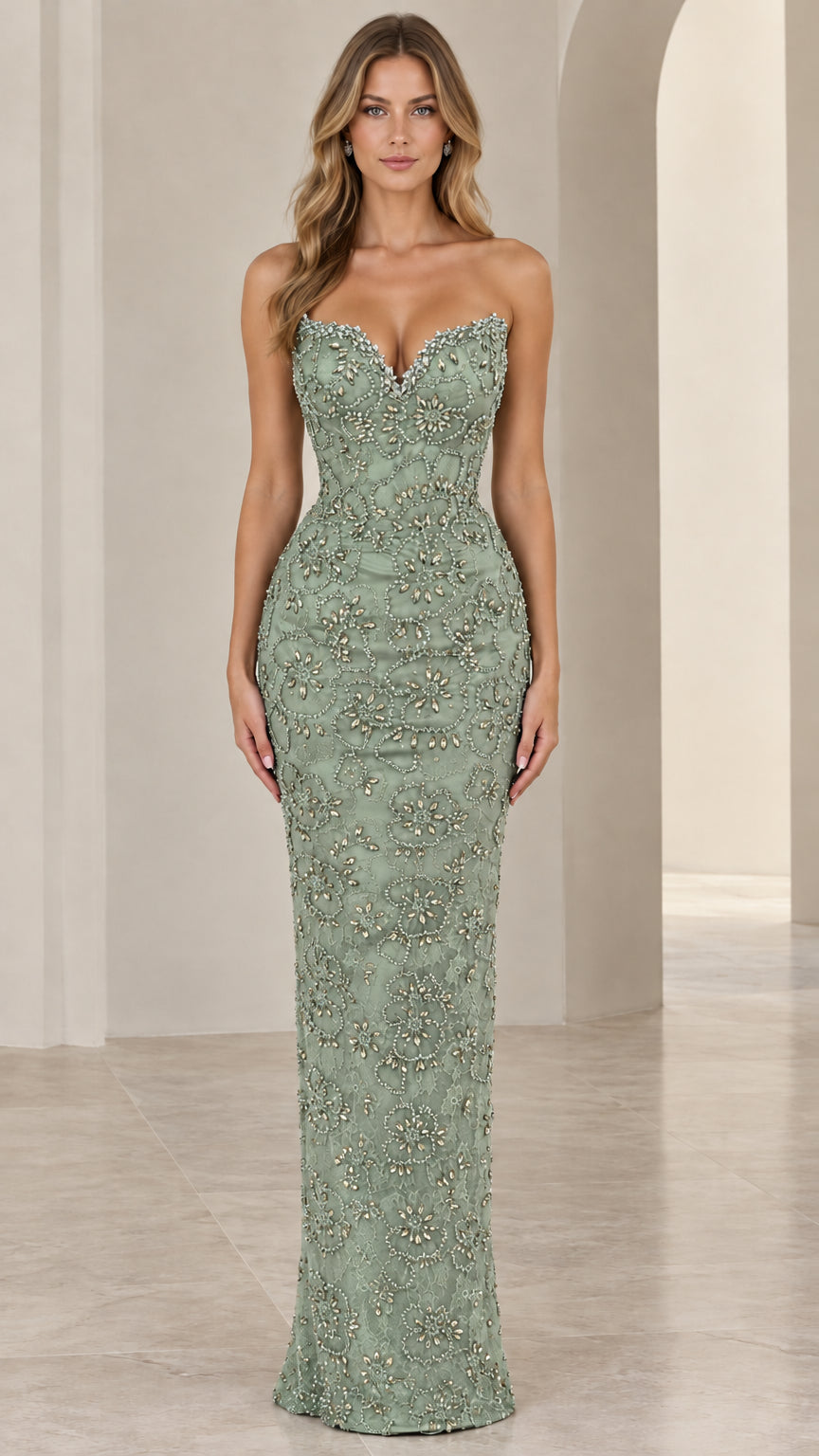 Front view of model wearing sage green strapless beaded formal gown