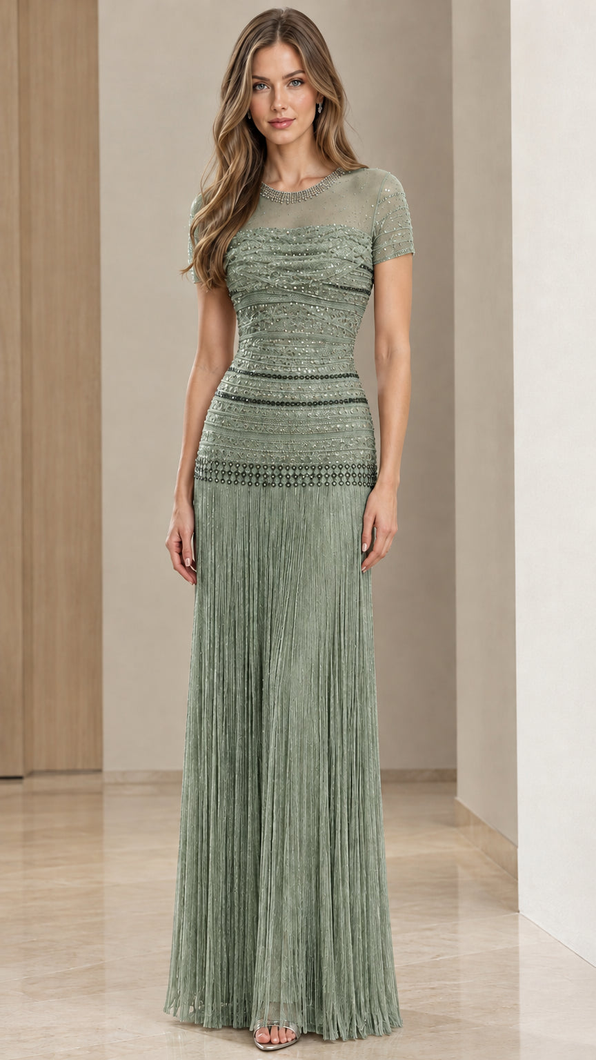Sage green beaded formal gown with sheer neckline and fringe skirt