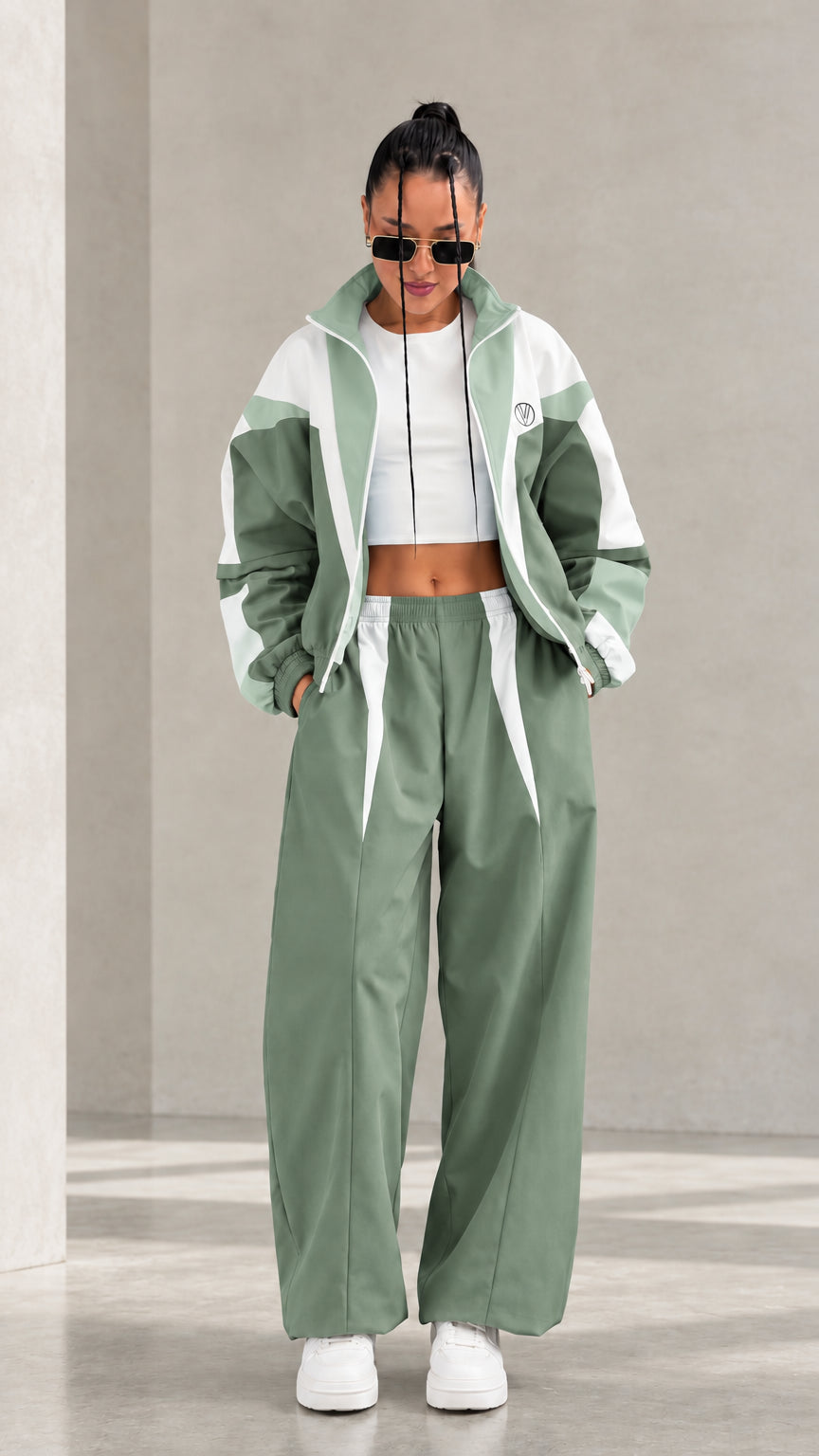 Model wearing Sage Green colorblock tracksuit set with white accents