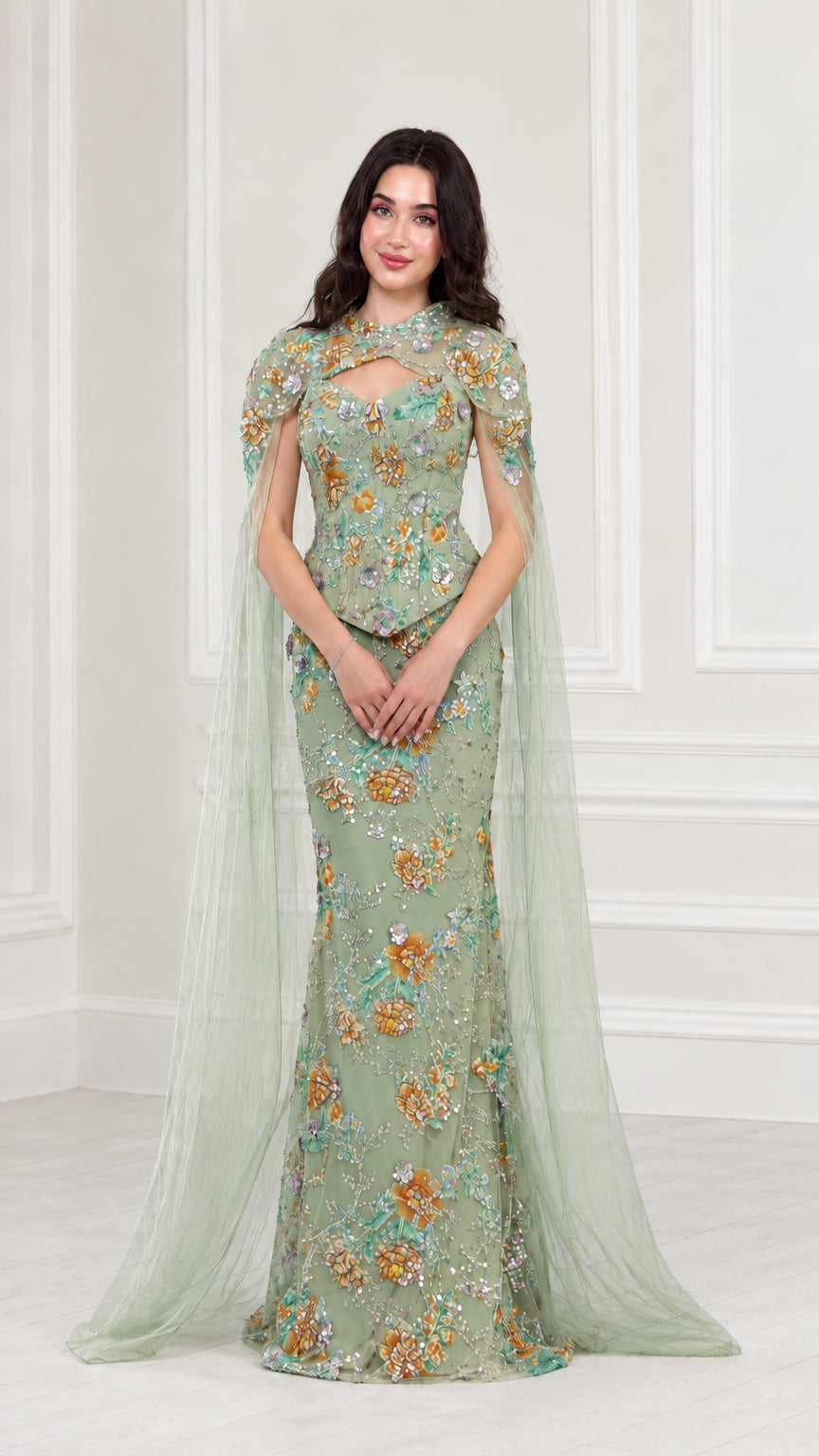 Front view of Sage Green floral embroidered evening gown with sheer green cape