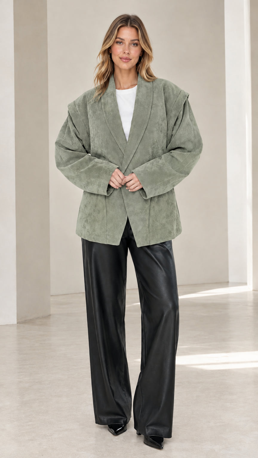 Front view of model wearing sage green faux suede oversized tailored blazer