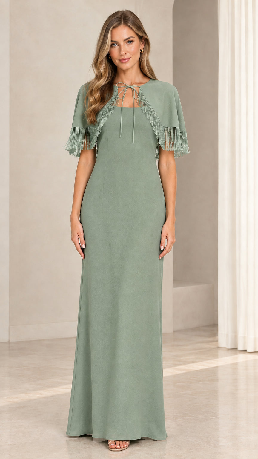 Model wearing sage green formal column gown with beaded fringe cape