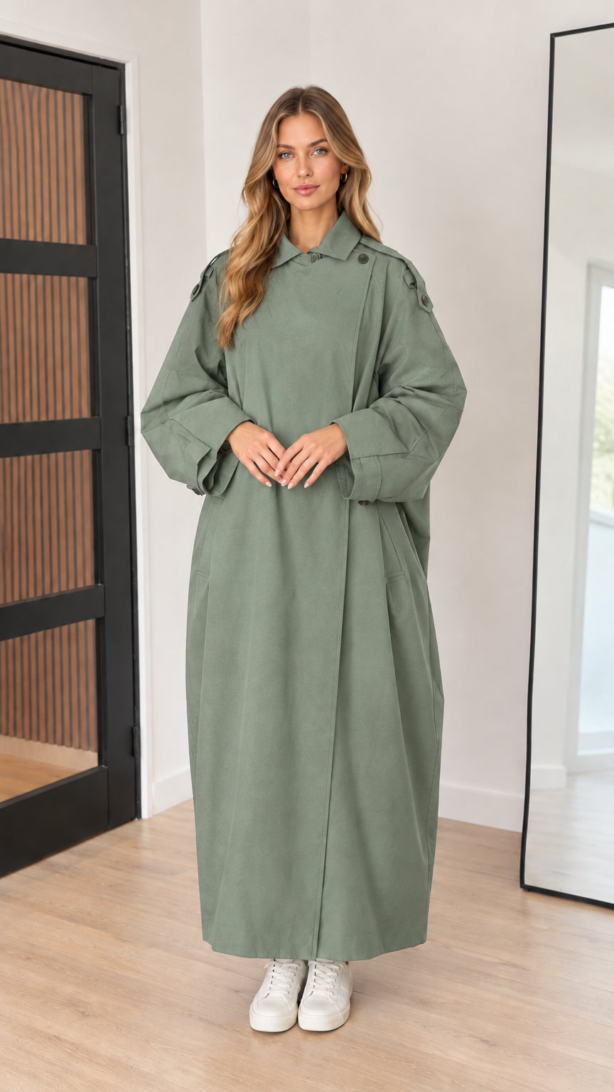 Full-length front view of sage green maxi trench coat on model