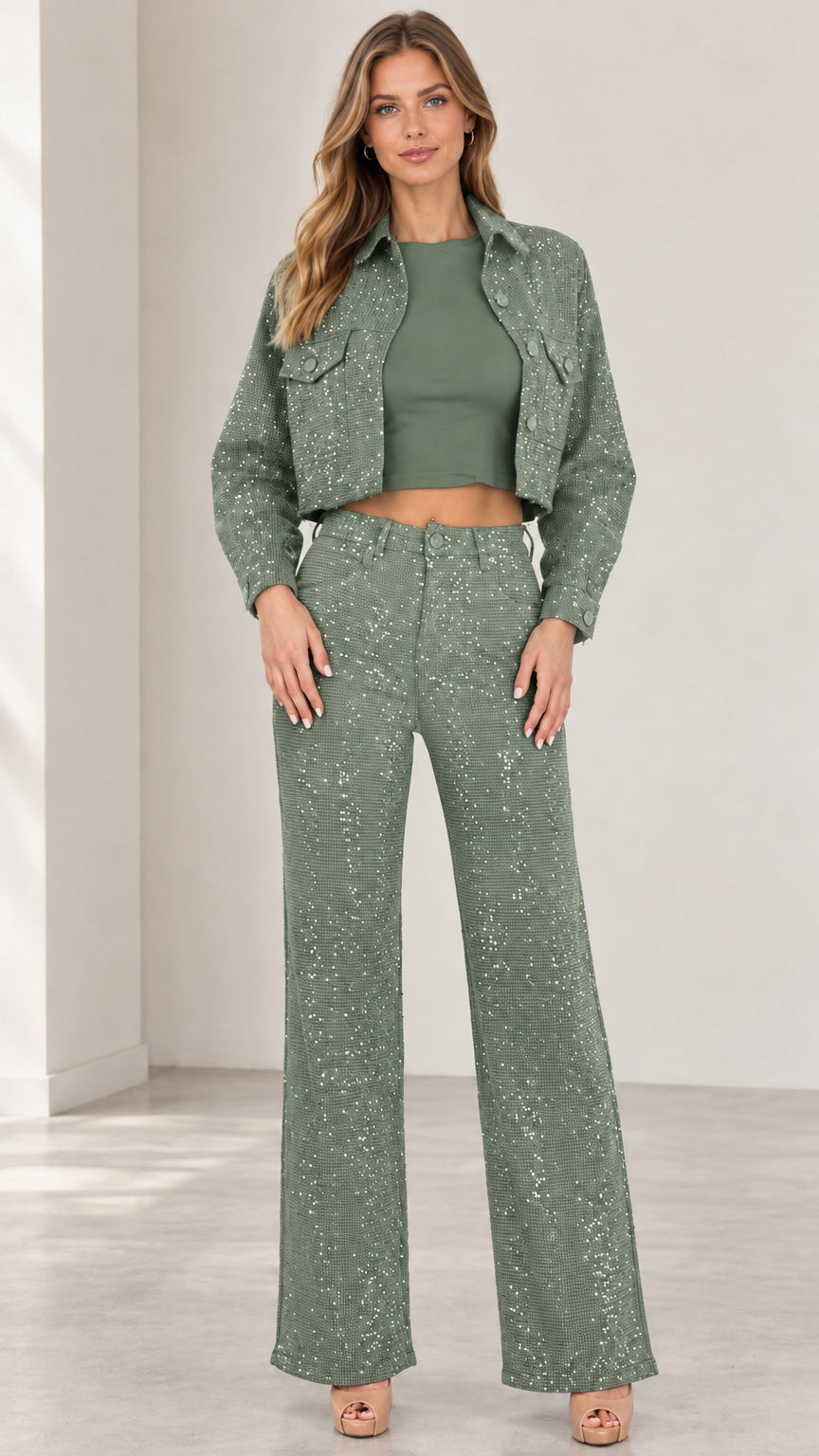 Front view of woman wearing sage green shimmer cropped jacket and wide-leg trousers set