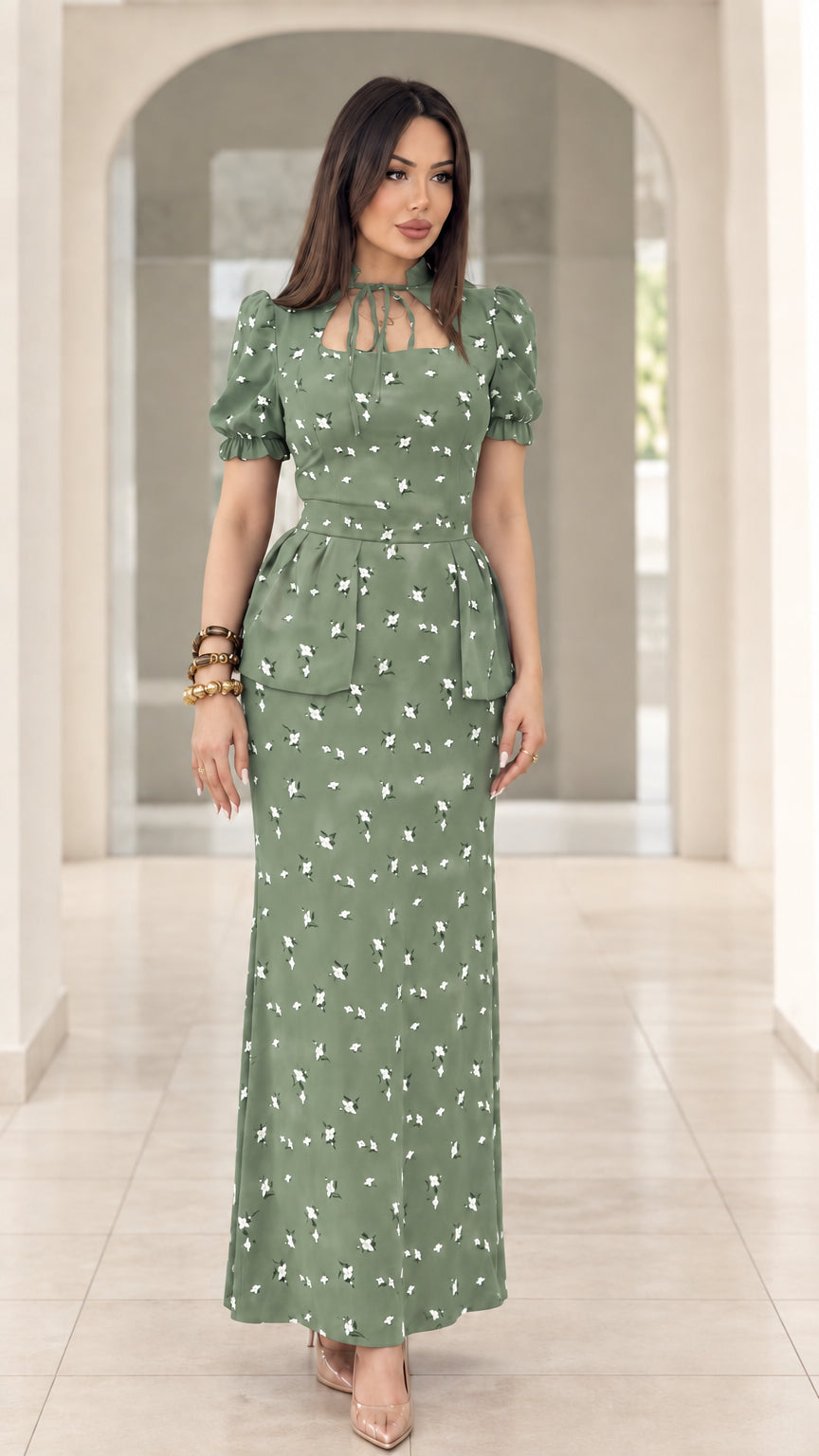 Model wearing sage green floral print peplum puff sleeve maxi dress