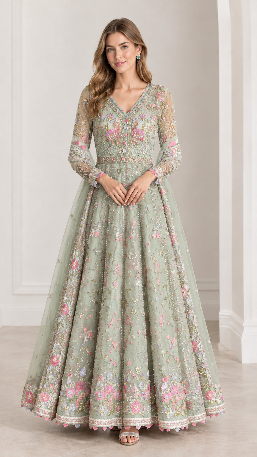 Full front view of model wearing Sage Green embroidered long sleeve formal gown