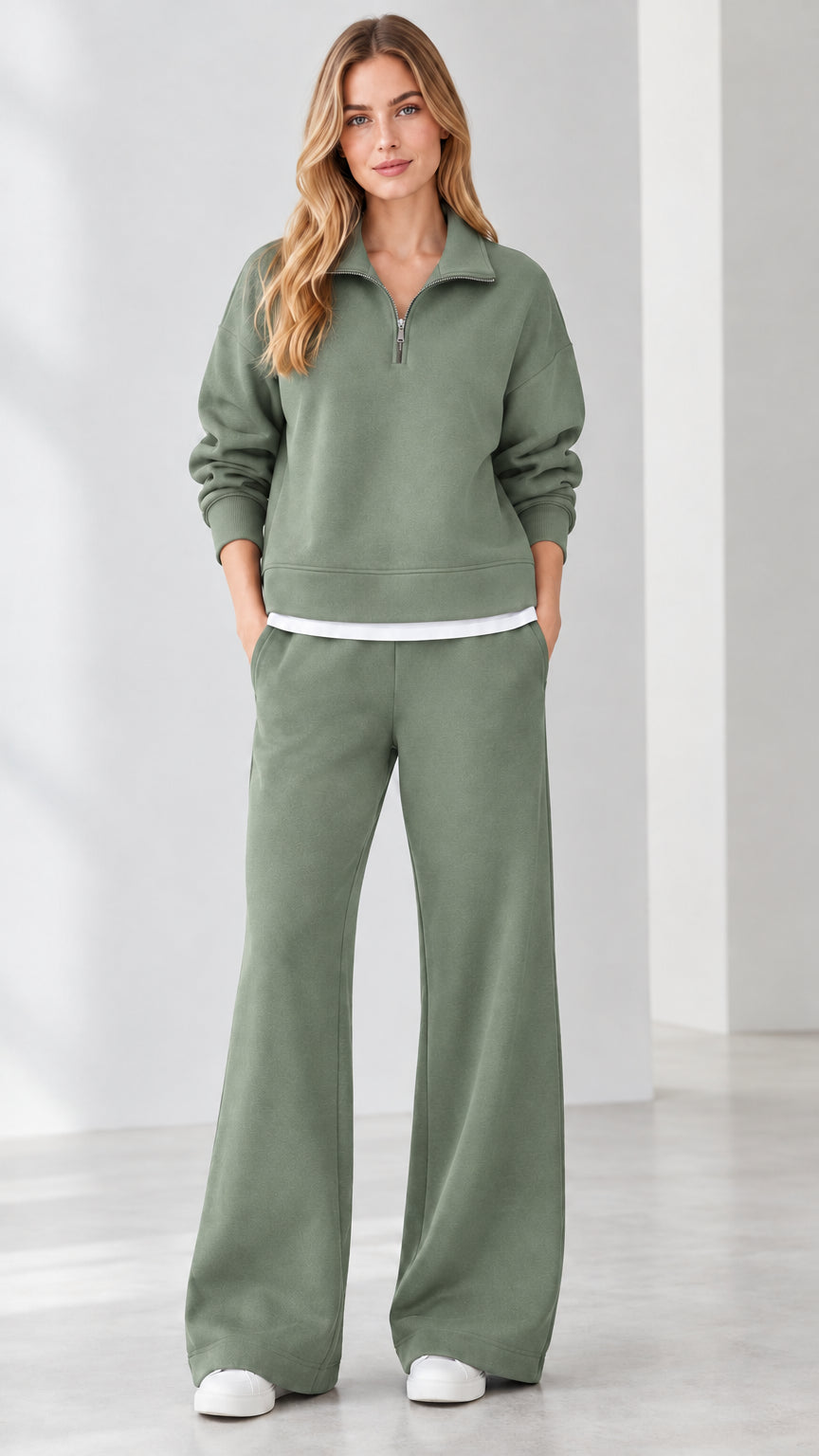 Front view of model wearing sage green half-zip loungewear set with wide-leg bottoms
