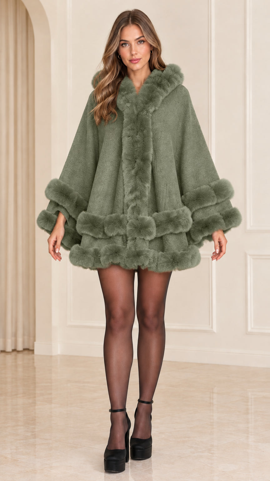 Front view of sage green faux fur trimmed hooded cape coat