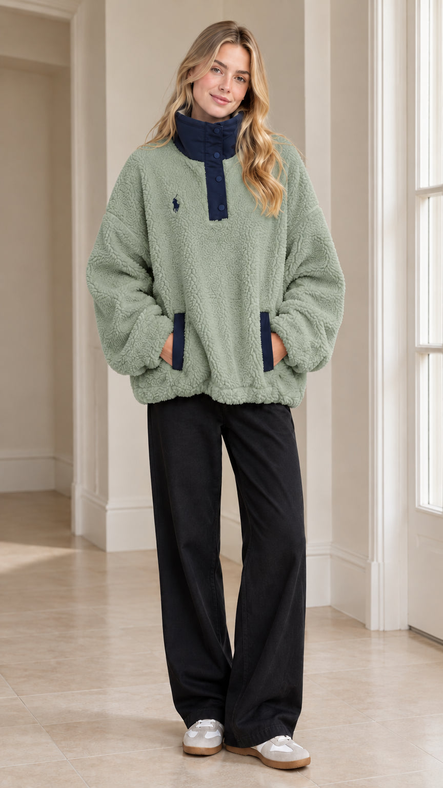 Full-length view of woman wearing Sage Green sherpa fleece snap-neck pullover