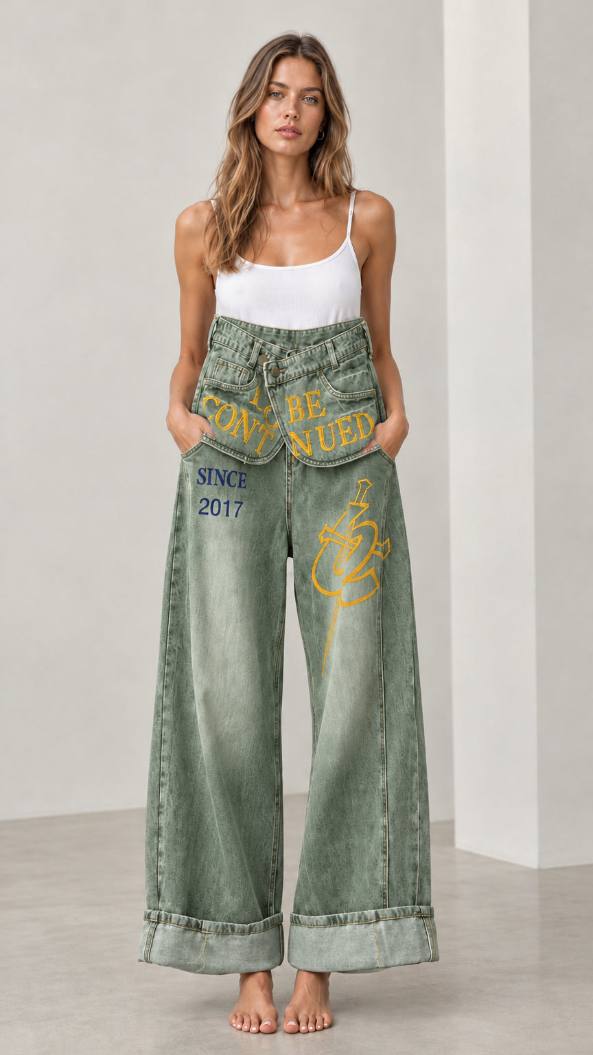 Front full view of Washed Green Fold-Over Waist Graphic Wide-Leg Jeans