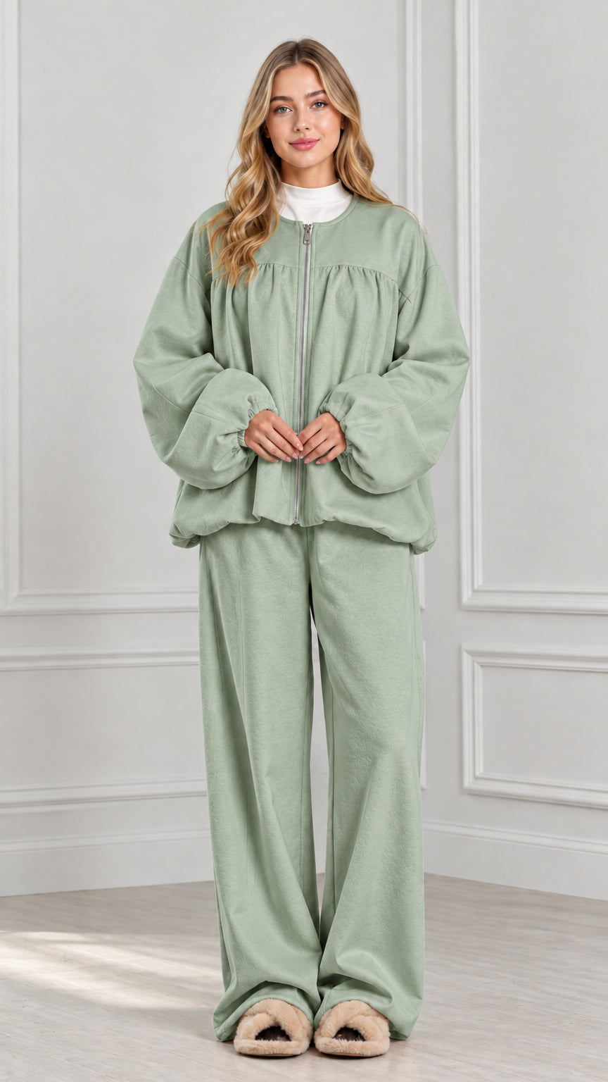 Full-body view of sage green two-piece zip jacket and wide-leg lounge set