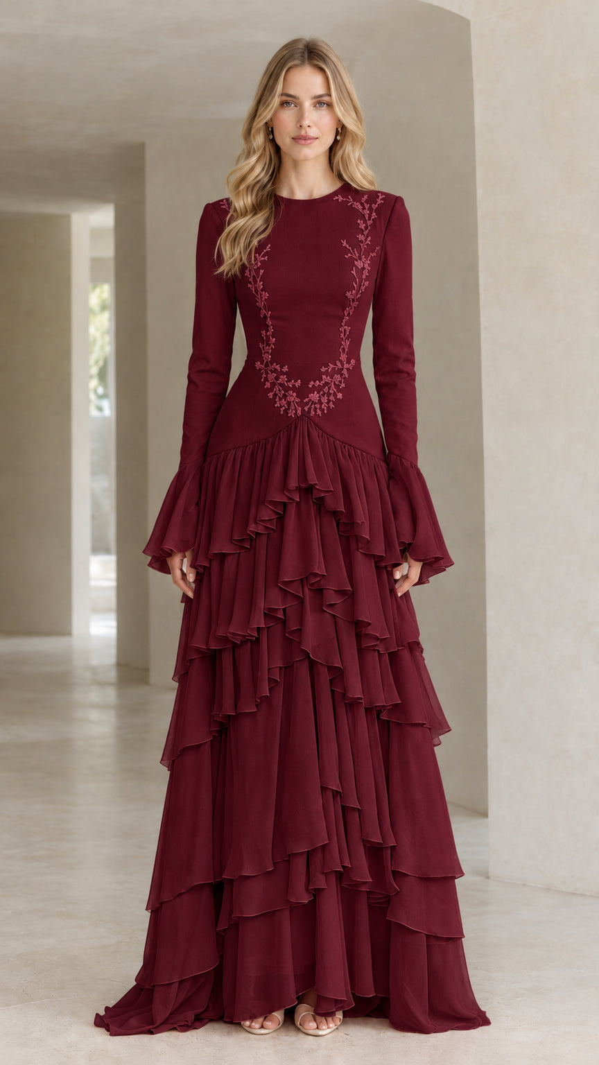 Front full view of woman wearing burgundy wine embroidered tiered ruffle long sleeve maxi dress