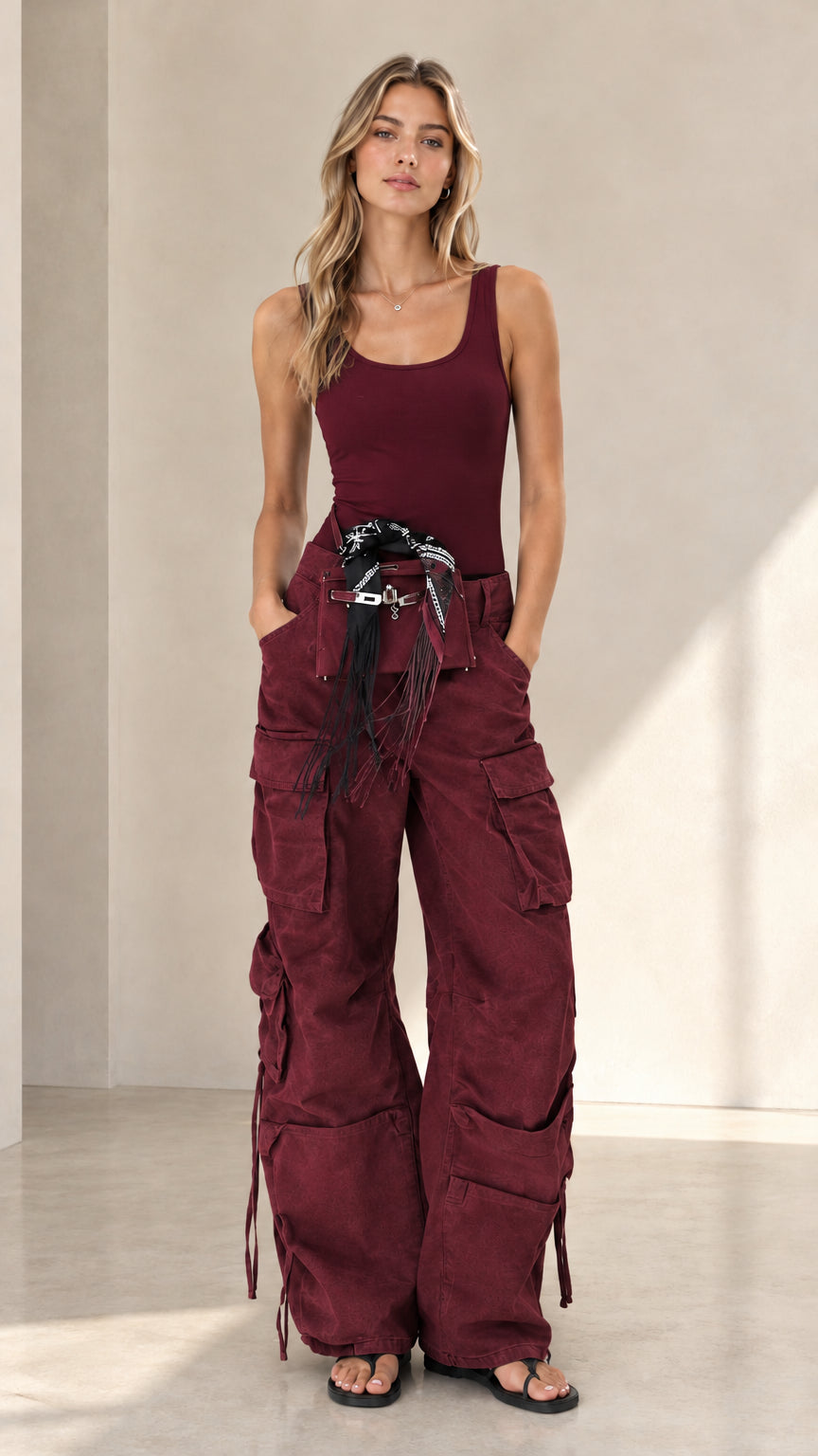 Front view of woman wearing burgundy wide leg utility cargo pants