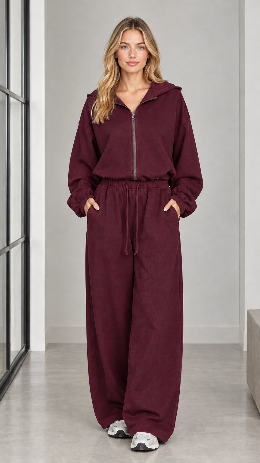Front full-length view of woman wearing the burgundy wine hooded wide-leg jumpsuit