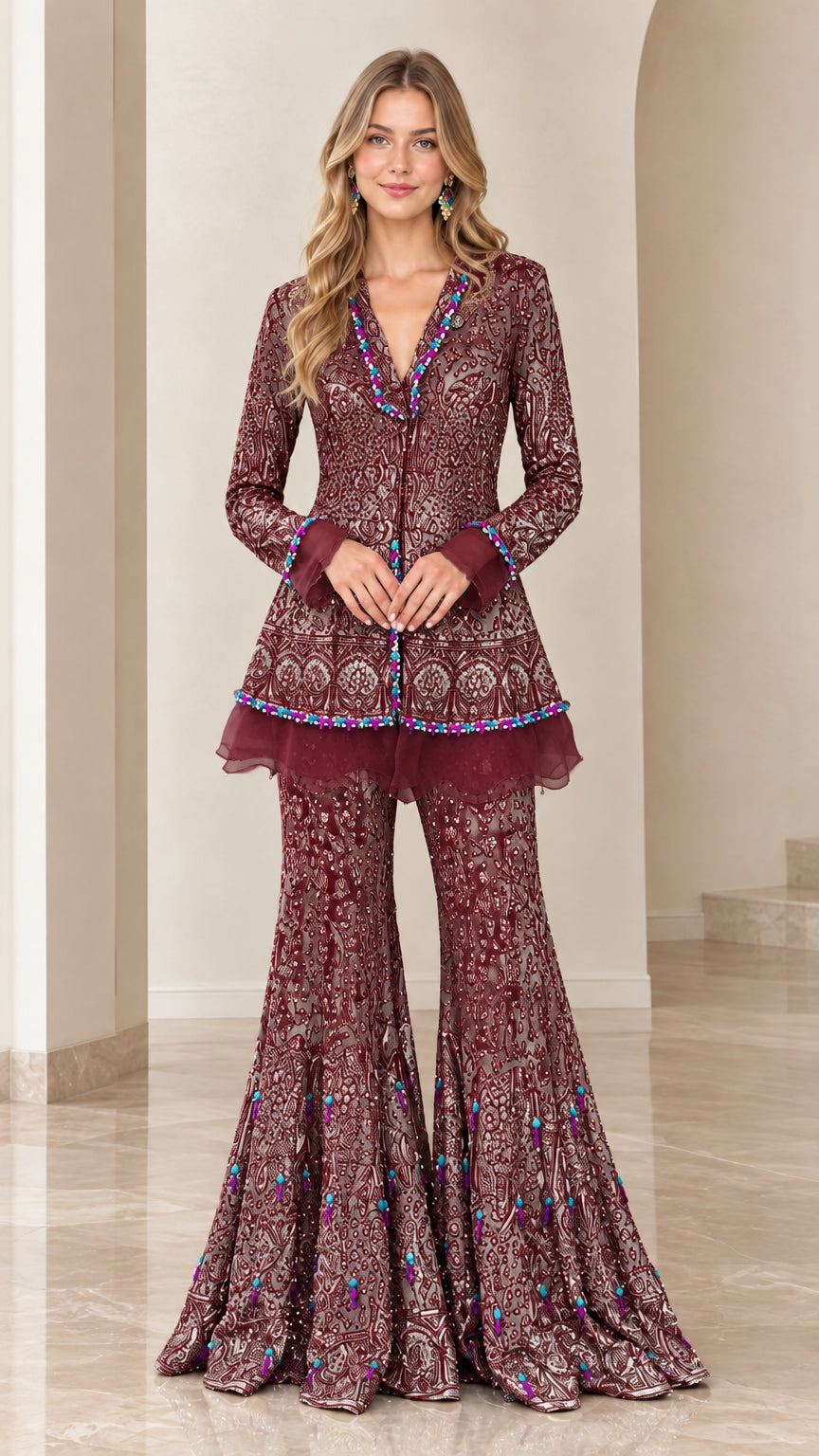 Front view of model wearing Burgundy embroidered peplum tunic and flared pants set