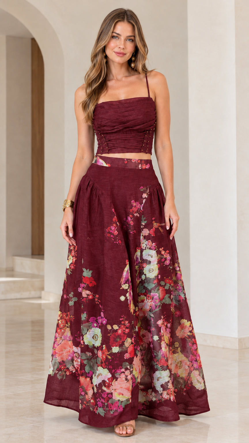 Full-length view of burgundy red floral two-piece crop top and maxi skirt set