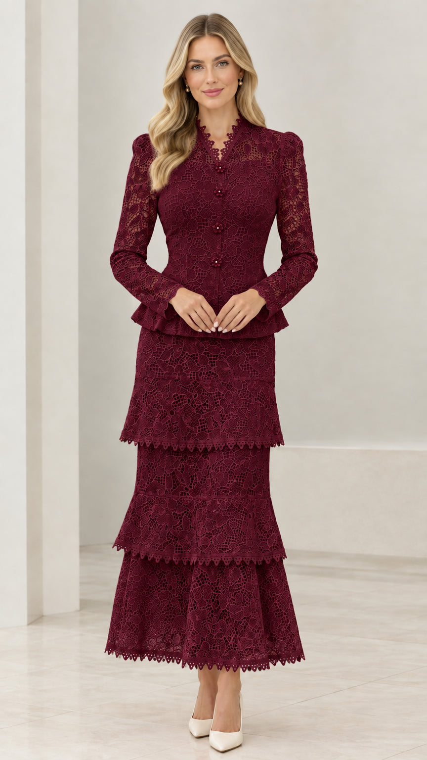Front view of model in Burgundy lace peplum jacket and tiered maxi skirt set