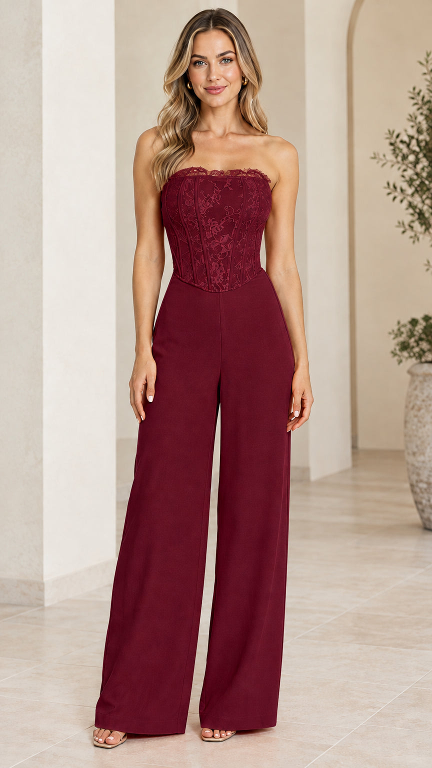 Front view of model wearing burgundy strapless lace corset wide leg jumpsuit