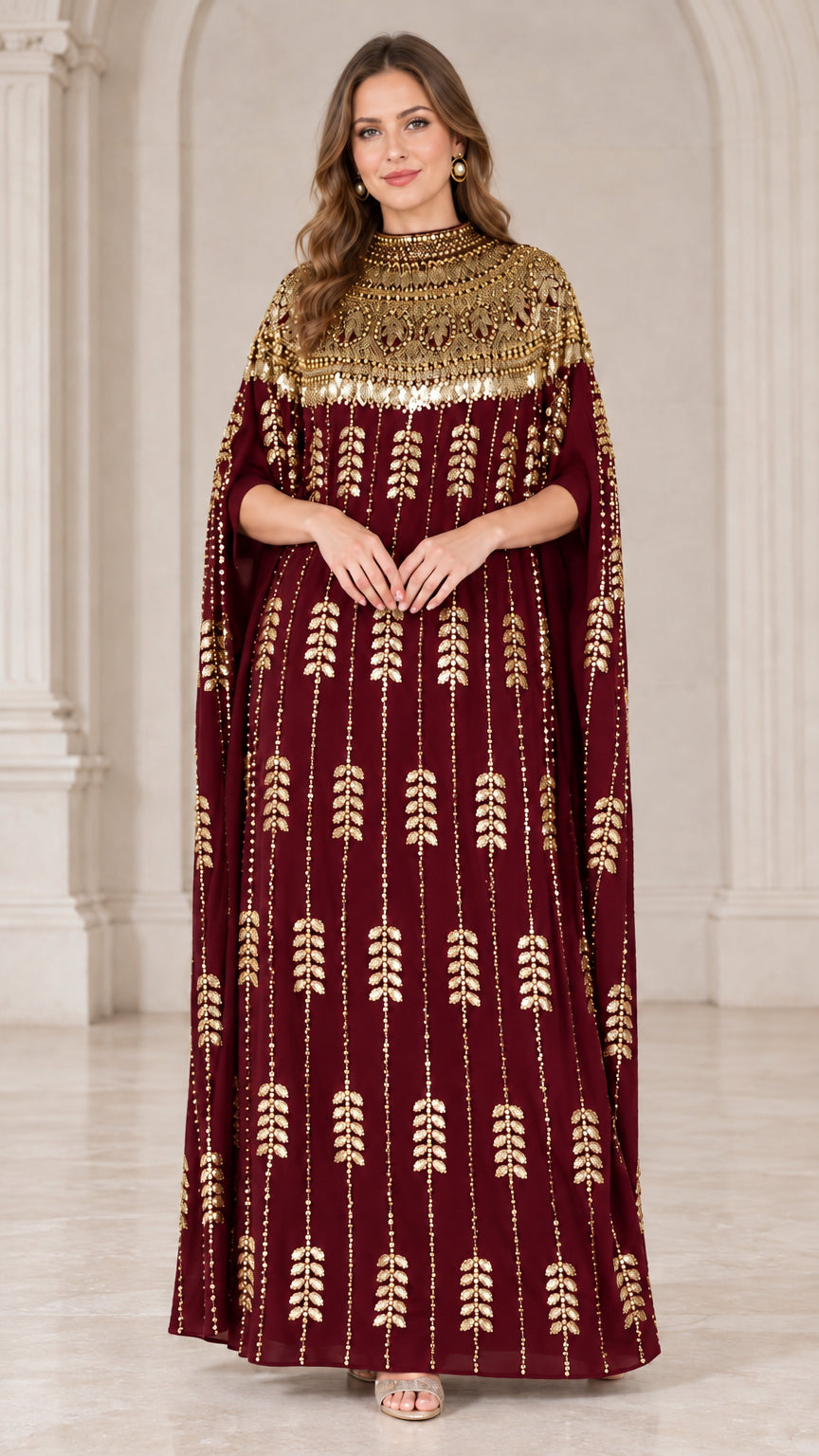 Burgundy kaftan evening gown with sparkling gold embellishments and cape sleeves