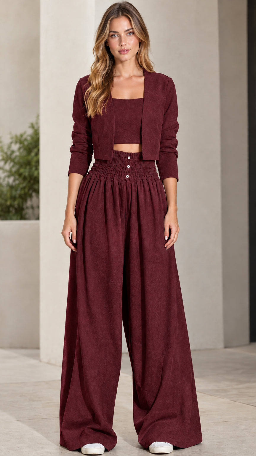 Front view of model wearing burgundy wine 3-piece crop top, jacket, and wide-leg pants set