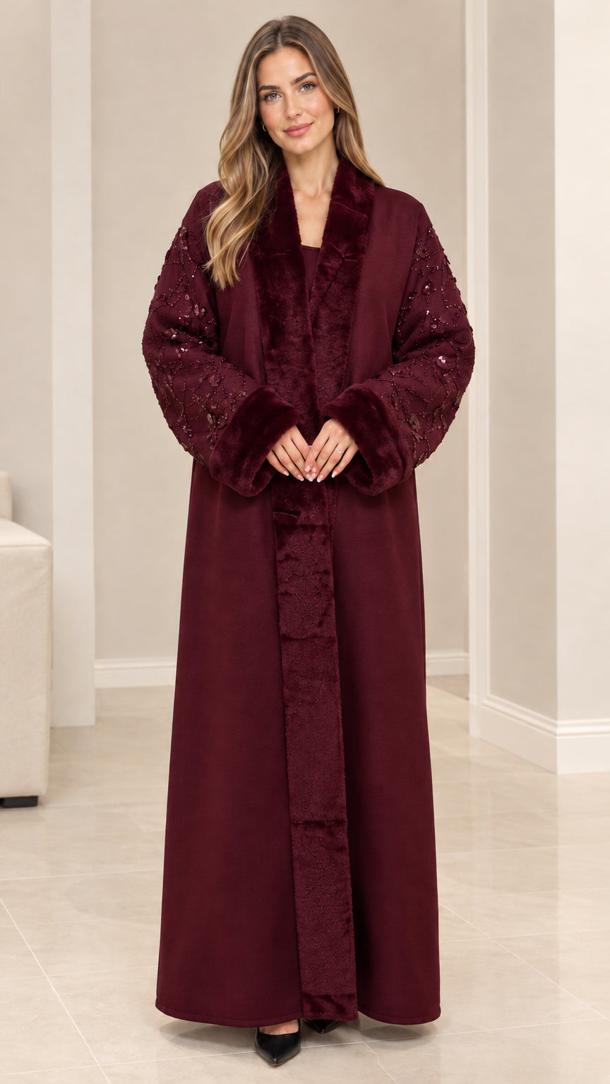 Front view of model wearing burgundy wine red faux fur trim sequin abaya coat