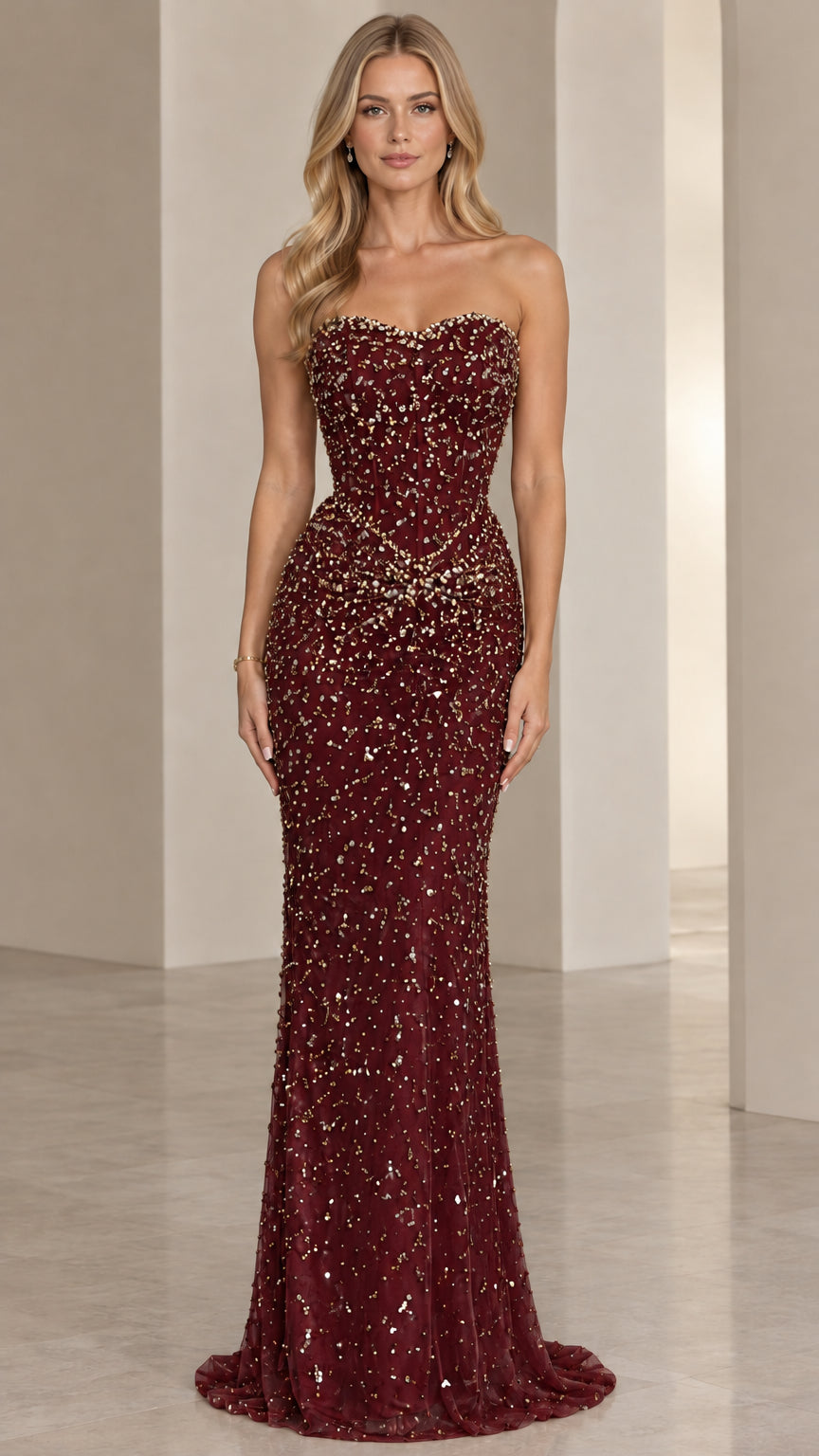 Front view of model wearing Burgundy strapless beaded corset evening gown