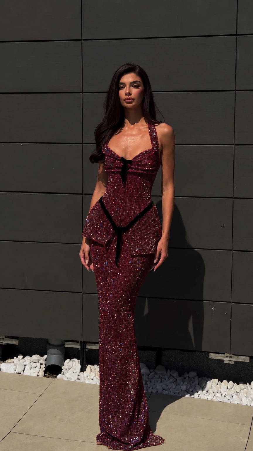 Model wearing burgundy wine glitter peplum maxi dress