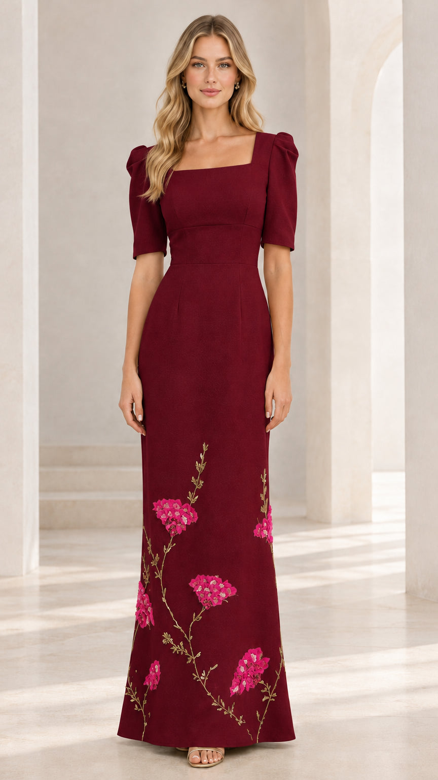 Full-length front view of burgundy formal evening gown with floral embroidered skirt