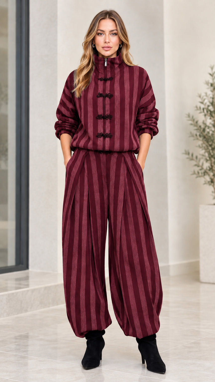 Model wearing burgundy wine red striped two-piece pant set