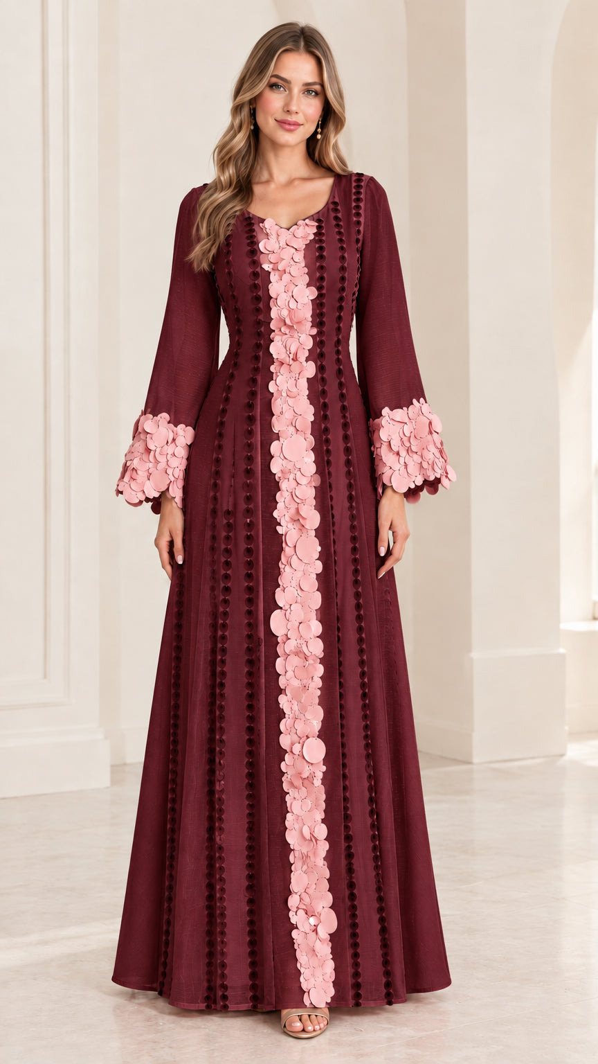Full-length front view of burgundy long sleeve evening dress with pink floral applique trim