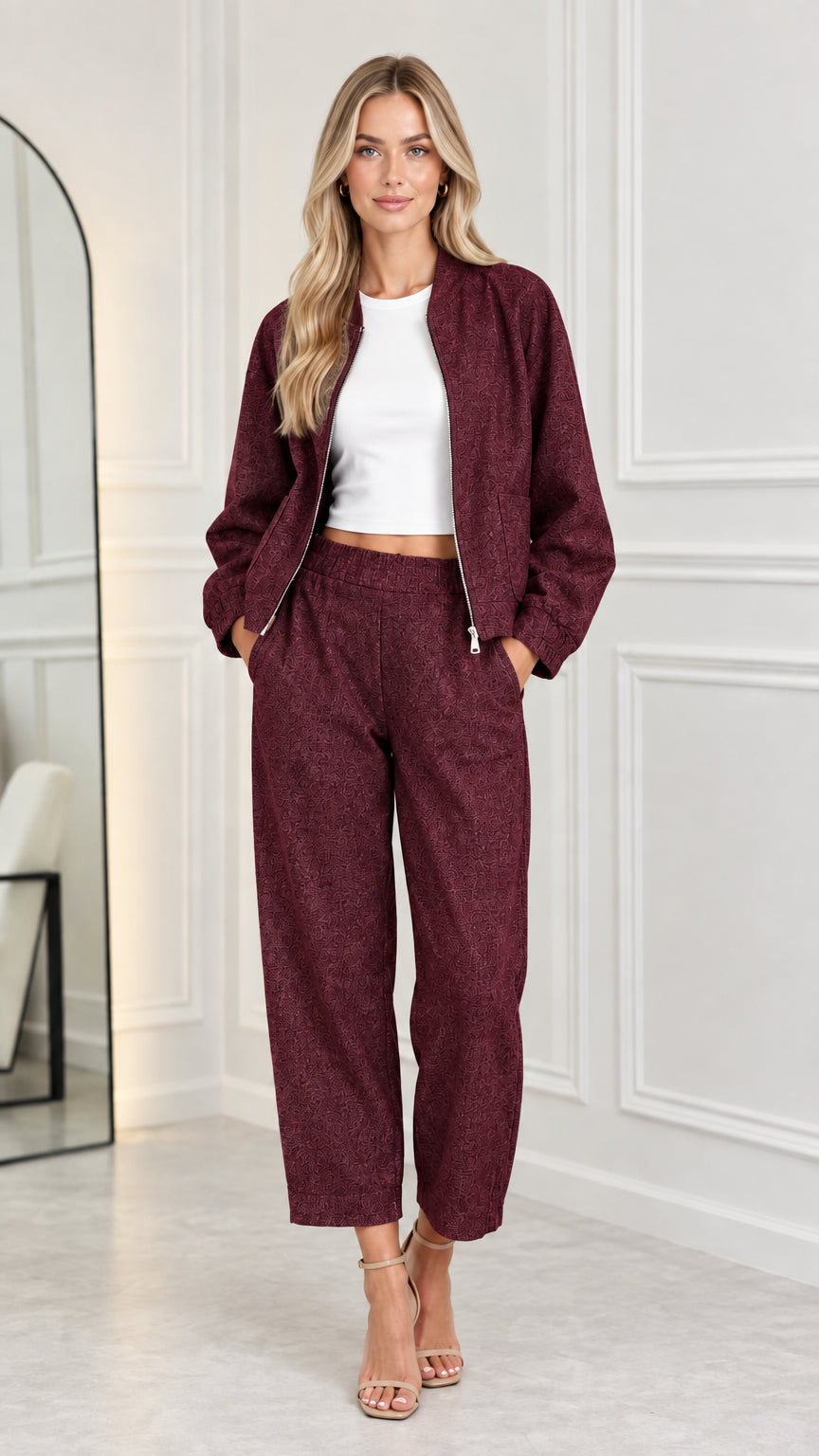 Full front view of model wearing the matching two-piece set in burgundy