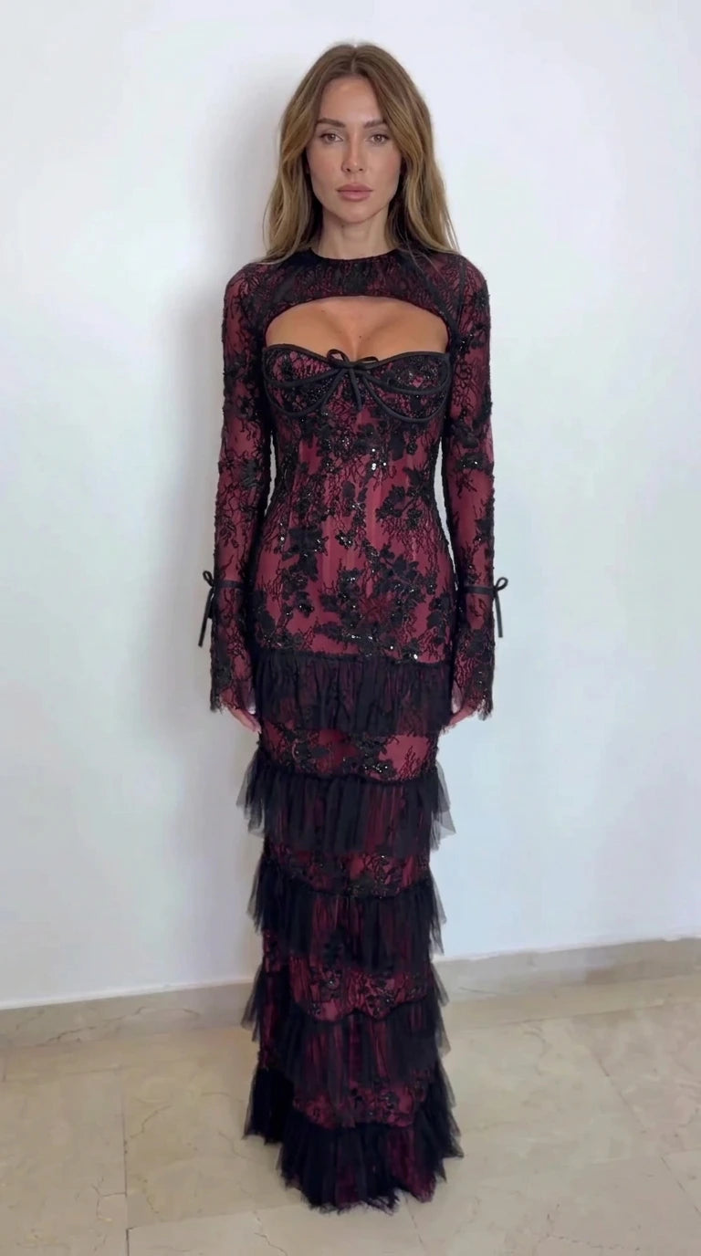 Model wearing black lace tiered maxi dress with burgundy wine lining