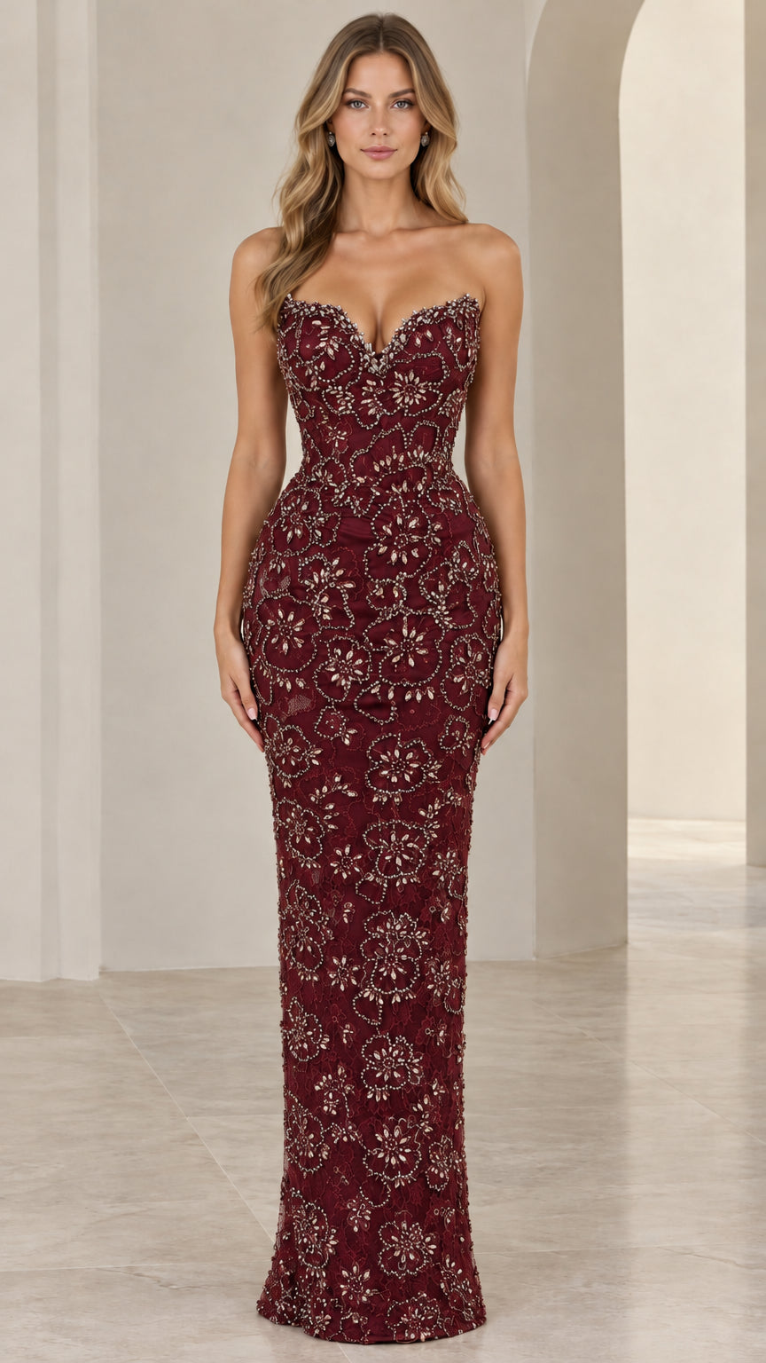 Front view of model wearing burgundy wine strapless beaded evening dress